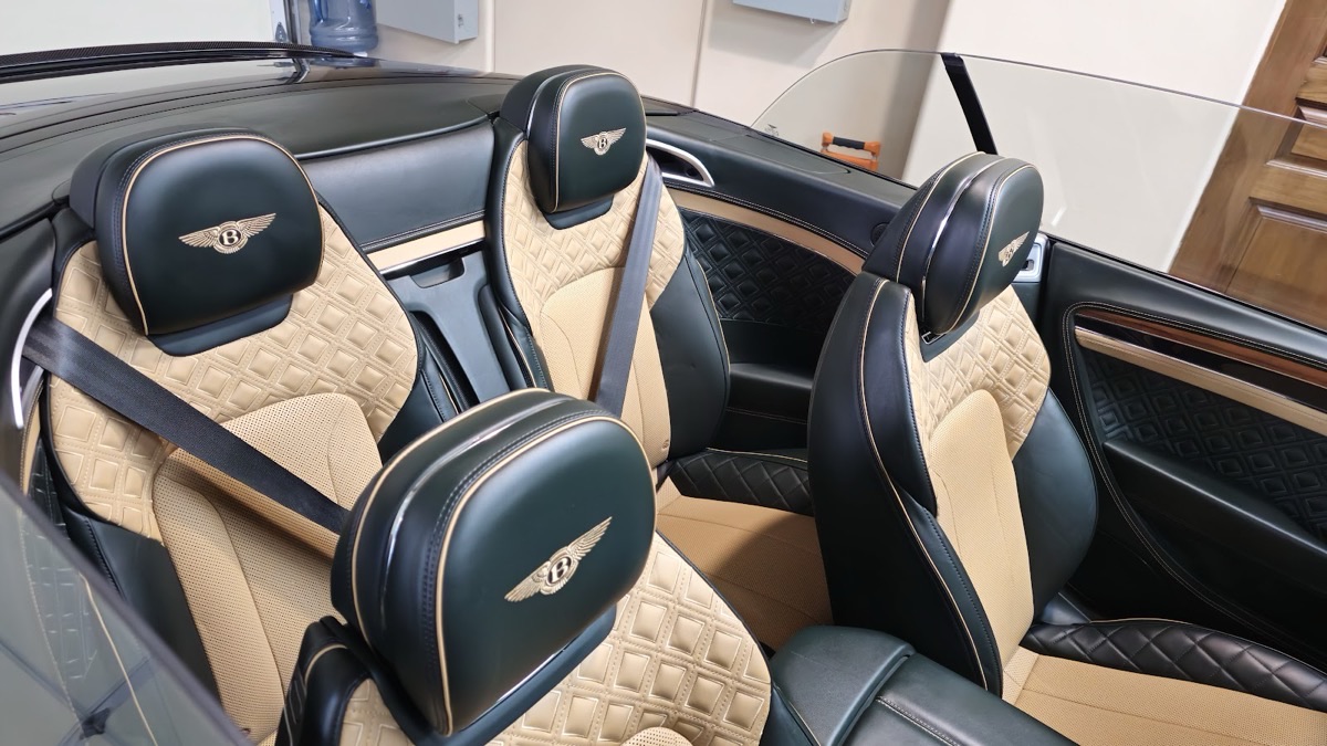 Spotless Bentley convertible interior with black and tan quilted leather