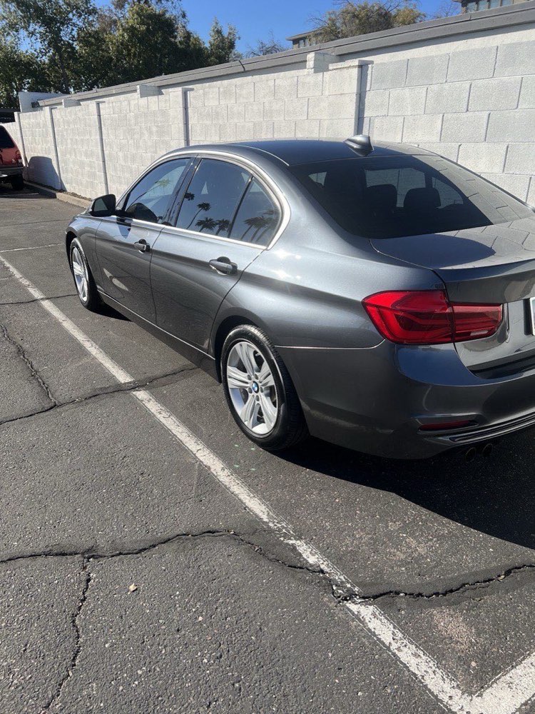 Gray BMW 3 Series with glossy paint after a mobile detail in Phoenix