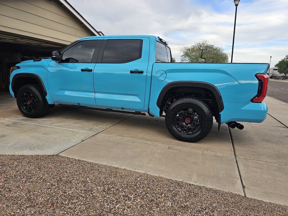 Freshly detailed blue Toyota Tundra TRD Pro in a Phoenix driveway